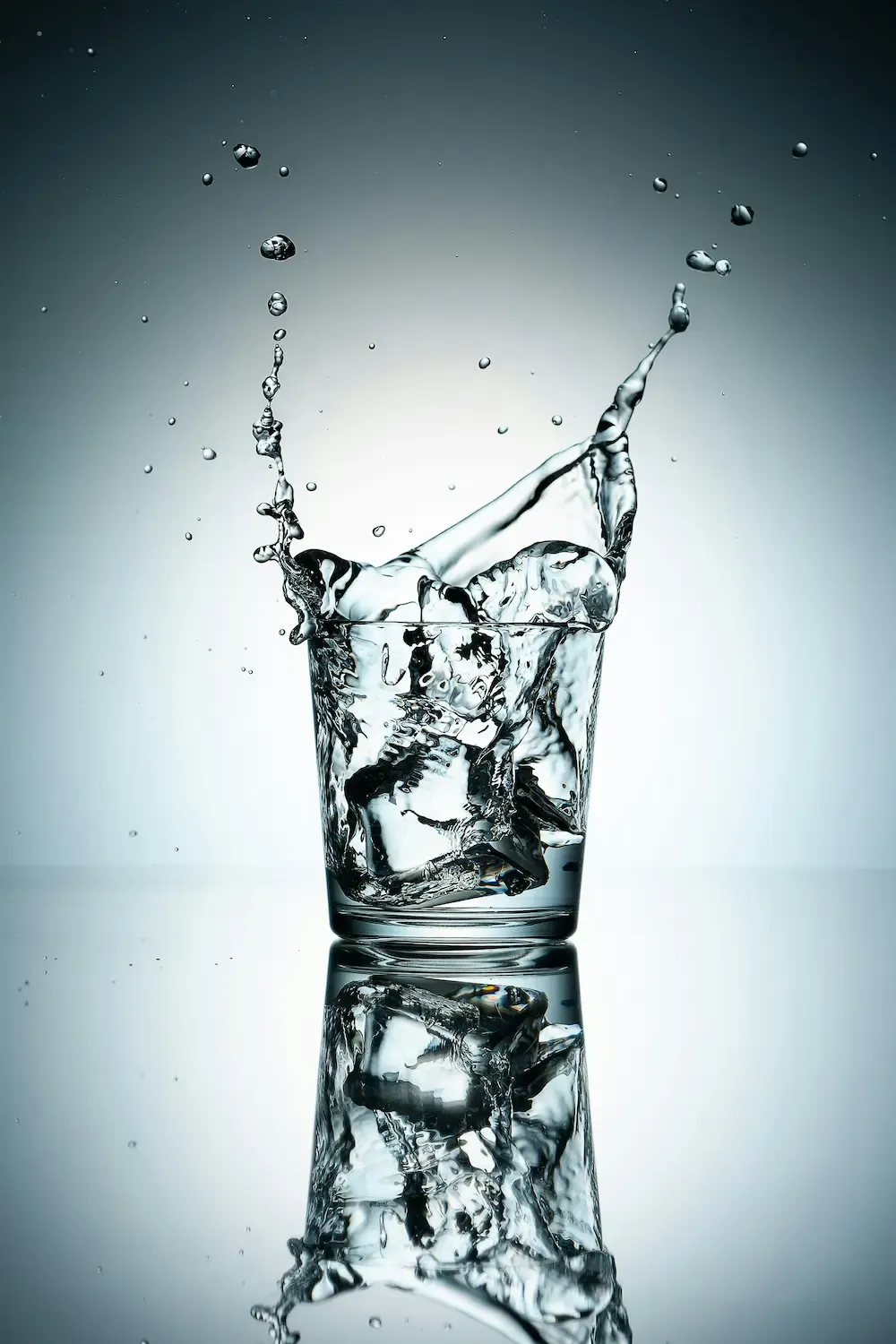 Ice cube splashing into water