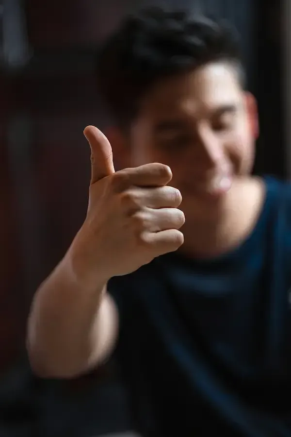 Man with thumbs up