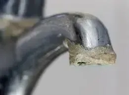 Limescale effect on a tap