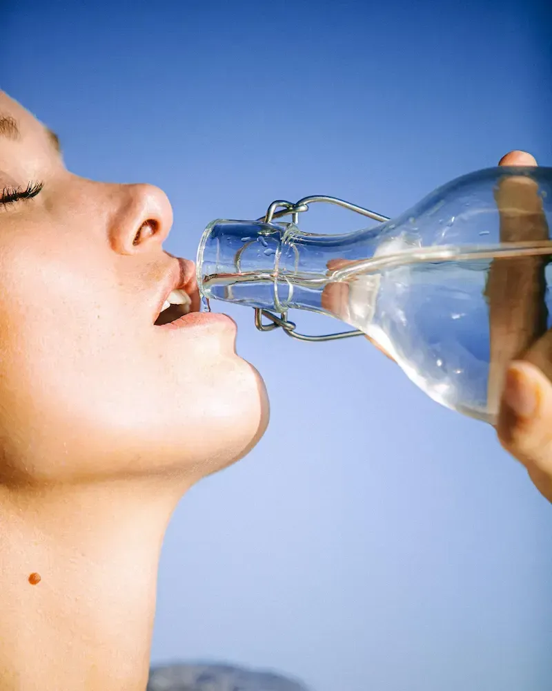 Woman drinking water from a bottle
