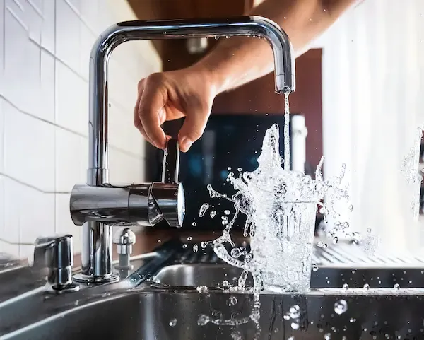 Tap dispensing water